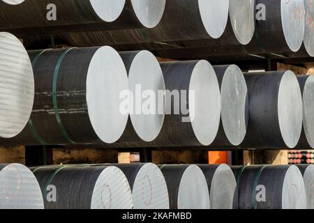 aluminium round bars in outdoor storage Stock Photo