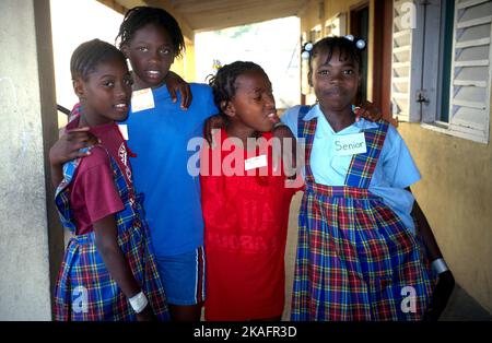 Portrait of two smiling school girls in classroom Stock Photo - Alamy