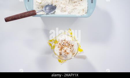 Step by step. Scooping batter with batter scooper into cupcake pan lined  with paper cupcake liners Stock Photo - Alamy