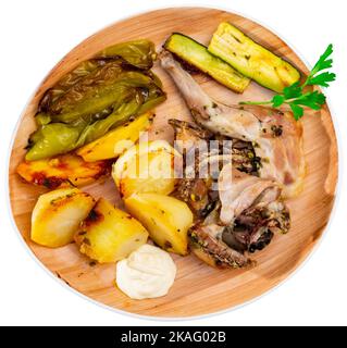 Roasted rabbit served with vegetable garnish Stock Photo