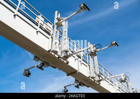 Close-up Of Security Camera On The Street. Multi-angle CCTV on pillar 360 degree system background blast cipping path operating over the road monitoring system of blue sky. Technology concept Stock Photo