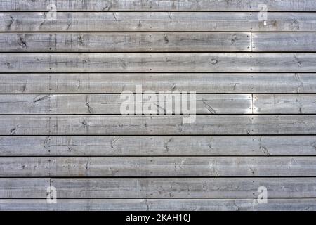 Background from a wall made of gray and worn wooden planks Stock Photo
