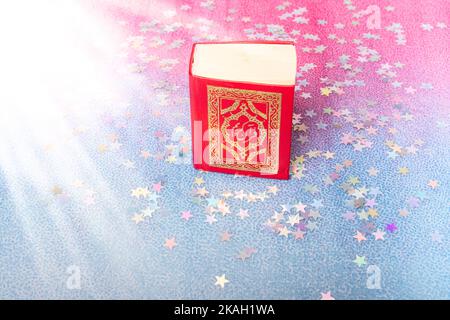Islamic Holy Book Quran  mini size decorated with stars Stock Photo