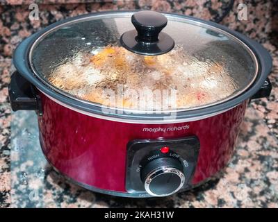 https://l450v.alamy.com/450v/2kah31w/a-morphy-richards-slow-cooker-kitchen-electrical-appliance-which-cooks-a-prepared-stew-overnight-delivering-tasty-food-with-low-energy-consumption-2kah31w.jpg