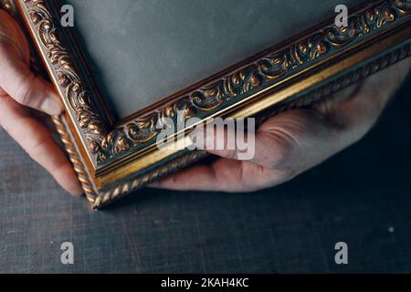 Framing Workshop. Making assembly stapler brackets baguette handmade picture frame at studio. Stock Photo