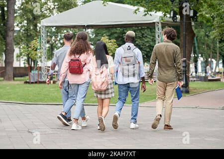 group of students walking together. Concepts of friendship and l Stock Photo