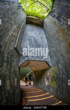 Spiral staircase at Fort Canning Park. This park is an iconic hilltop landmark in Singapore. Stock Photo