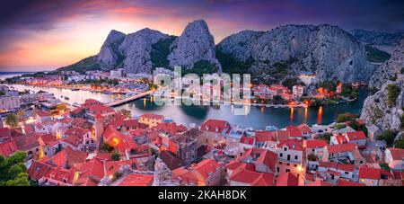 Omis, Croatia. Panoramic cityscape image of beautiful coastal town Omis, Dalmatia, Croatia at summer sunset. Stock Photo
