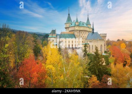 Bojnice Castle. Aerial view of neo-gothic romantic, fairytale castle in colorful autumn landscape.  UNESCO heritage landscape travel concept. Slovakia Stock Photo