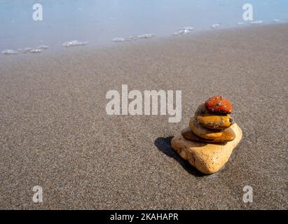 Balance stones on the beach as a background Stock Photo