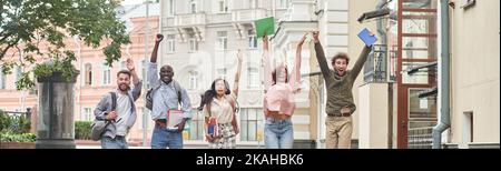 happy group of students having fun on a city street. Stock Photo