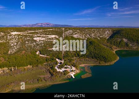 The serpentine road to the Visovac Island pier in Krka national park in Croatia Stock Photo