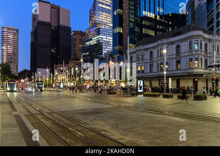 Light rail trams at Circular Quay at blue hour in Sydney, Australia Stock Photo