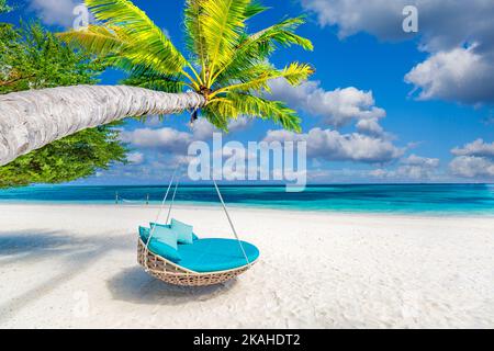 Tropical island beach, luxury summer landscape beach swing or hammock on palm tree with white sand calm seaside for beach banner. Amazing scenic beach Stock Photo