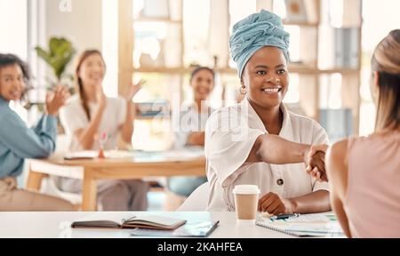 Handshake, interview and employees meeting with congratulations, thank you and motivation at work. Success, support and creative people in a Stock Photo