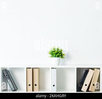 White office shelves with different stationery, close up. Stock Photo
