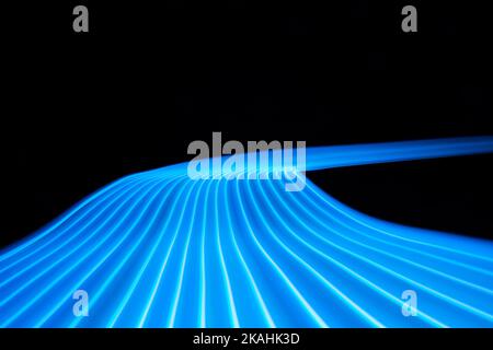Neon technology data road path stripes. Digital lines on black background. Stock Photo