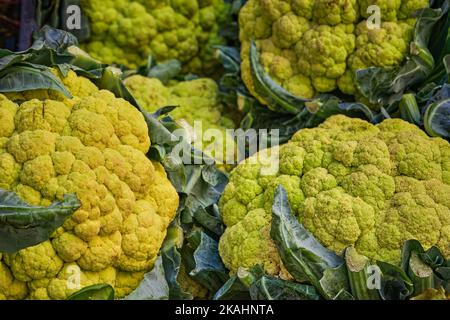 Green cauliflower heads on a street market in Italy Stock Photo