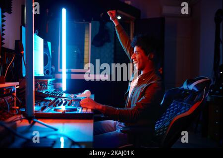 Emotional music sound producer at workplace Stock Photo