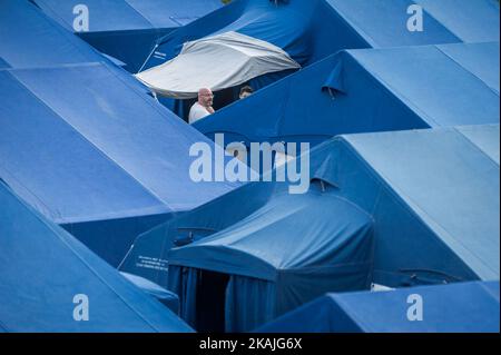 People in a tent camp in Arquata del Tronto hit by earthquake, Italy, on August 26, 2016. The death toll from a powerful earthquake that killed at least 240 people in central Italy on August 25, 2016 amid fears many more corpses would be found in the rubble of devastated mountain villages. Rescuers sifted through collapsed masonry in the search for survivors, but their grim mission was clouded by uncertainty about exactly how many people had been staying in communities closest to the epicentre of the quake of August 24. (Photo by Adamo Di Loreto/NurPhoto) *** Please Use Credit from Credit Fiel Stock Photo