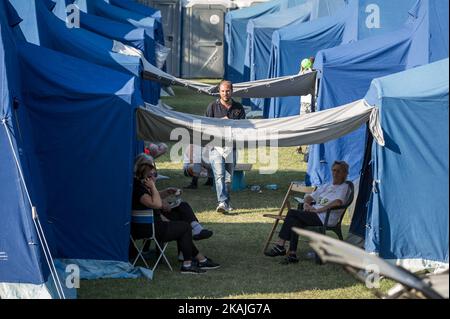 People in a tent camp in Arquata del Tronto hit by earthquake, Italy, on August 26, 2016. The death toll from a powerful earthquake that killed at least 240 people in central Italy on August 25, 2016 amid fears many more corpses would be found in the rubble of devastated mountain villages. Rescuers sifted through collapsed masonry in the search for survivors, but their grim mission was clouded by uncertainty about exactly how many people had been staying in communities closest to the epicentre of the quake of August 24. (Photo by Adamo Di Loreto/NurPhoto) *** Please Use Credit from Credit Fiel Stock Photo