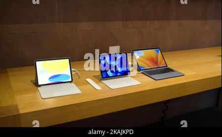 Paris, France - Oct 28, 2022: Apple store showcase with new iPad redesigned model, ipad Pro and macBook pro laptop Stock Photo