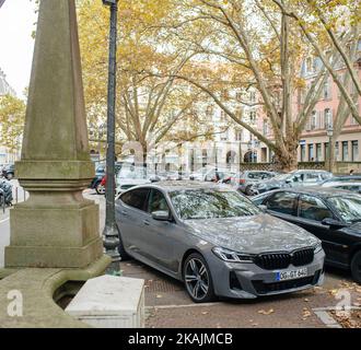 Strasbourg, France - Oct 28, 2022: New luxury gray BMW m sport car parked in city center - large area with multiple luxury cars Stock Photo