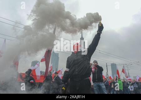 Polish nationalists under the slogan 'Poland the Bastion of Europe' during their rally, as hundreds of thousands of marchers took to the streets of Warsaw in a few separate rallies on Friday 11th November to mark the 98th anniversary of Poland’s independence.  On Friday, 11 November 2016, in Warsaw, Poland. Photo by Artur Widak *** Please Use Credit from Credit Field *** Stock Photo