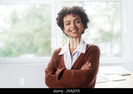 business woman standing near a desktop in a coworking center. Stock Photo