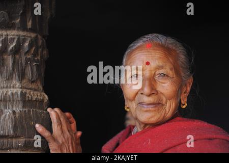 A Portrait of an old woman glancing the Indrayani Festival at Kiritpur, Kathmandu, Nepal on Friday, December 09, 2016. It is the part of famous festival celebrated annually marking the arrival of winter. Jatras and festivals are part of life for Newar community. (Photo by Narayan Maharjan/NurPhoto) *** Please Use Credit from Credit Field *** Stock Photo