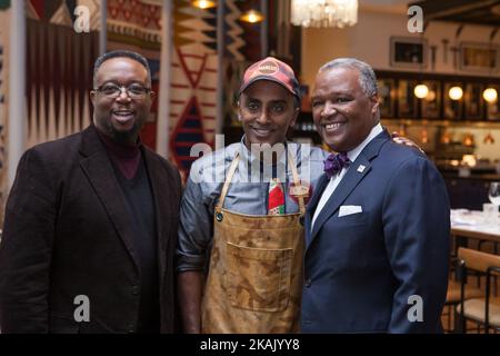 (2nd left to right), celebrity chef Marcus Samuelsson, poses for a photo with Rushern L. Baker III, County Executive, Prince George's County, in the restaurant, Marcus, open 24 hours at MGM National Harbor, in Washington, D.C. on Thursday, December 8, 2016 (Photo by Cheriss May/NurPhoto) *** Please Use Credit from Credit Field *** Stock Photo