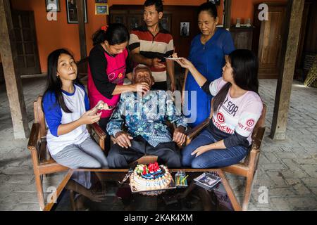 Mr. SODIMEJO known as Mbah Goto is Celebrating his 146 Years old birthday at his home town - Seragen, Central Java on 31 December 2016. From his Indonesian ID Mbah Goto documented birth on 31 December 1870, if the administration is right his age is 146 years and claimed to be the oldest man on earth. The birthday celebration held in humble situation attend by his grand grand son Mr. SURYANTO and Wife Mr. SUWARNI with their children ERIKA KURNIAWATI and ANISA KURNIAWATI. (Photo by Donal Husni/NurPhoto) *** Please Use Credit from Credit Field *** Stock Photo
