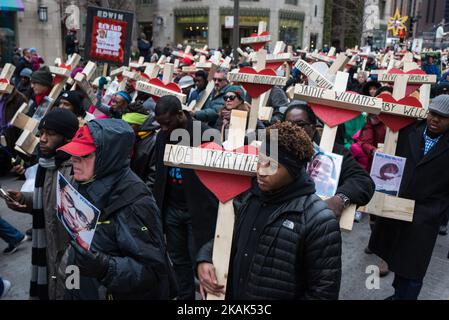 People carry over 750 wooden crosses dedicated to lives lost to violence during 2016 in Chicago during a peace march on Michigan Avenue in Chicago on December 31, 2016. Over 750 people were killed this year in Chicago, making it the deadliest year in almost two decades. (Photo by Max Herman/NurPhoto) *** Please Use Credit from Credit Field *** Stock Photo