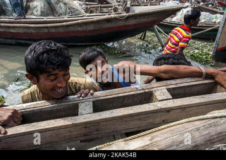 Brave fishermen of Bhola, Bangladesh on 31 December 2016. Bhola is a southern coastal district of Bangladesh, agriculture and fishing are two major profession for the people of Bhola. Fishermen are preparing their net and boat to go to the mighty river Meghna one of the most fierce river of Bangladesh.(Photo by Khandaker Azizur Rahman Sumon/NurPhoto) *** Please Use Credit from Credit Field *** Stock Photo