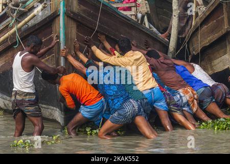 Brave fishermen of Bhola, Bangladesh on 31 December 2016. Bhola is a southern coastal district of Bangladesh, agriculture and fishing are two major profession for the people of Bhola. Fishermen are preparing their net and boat to go to the mighty river Meghna one of the most fierce river of Bangladesh.(Photo by Khandaker Azizur Rahman Sumon/NurPhoto) *** Please Use Credit from Credit Field *** Stock Photo