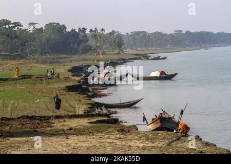 Brave fishermen of Bhola, Bangladesh on 31 December 2016. Bhola is a southern coastal district of Bangladesh, agriculture and fishing are two major profession for the people of Bhola. Fishermen are preparing their net and boat to go to the mighty river Meghna one of the most fierce river of Bangladesh.(Photo by Khandaker Azizur Rahman Sumon/NurPhoto) *** Please Use Credit from Credit Field *** Stock Photo