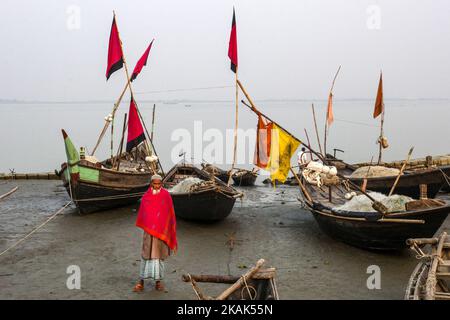 Brave fishermen of Bhola, Bangladesh on 31 December 2016. Bhola is a southern coastal district of Bangladesh, agriculture and fishing are two major profession for the people of Bhola. Fishermen are preparing their net and boat to go to the mighty river Meghna one of the most fierce river of Bangladesh.(Photo by Khandaker Azizur Rahman Sumon/NurPhoto) *** Please Use Credit from Credit Field *** Stock Photo