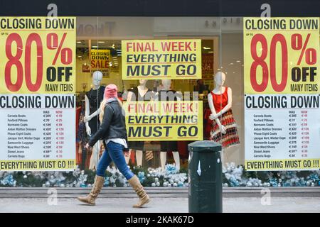 A view of a shop window in Dublin's Grafton Street with 'Closing Down 80% OFF Many Items' sign as the start of the new year brings with it all January sales and bargains. On Saturday, 7 January 2017, Dublin, Ireland. Photo by Artur Widak *** Please Use Credit from Credit Field ***  Stock Photo