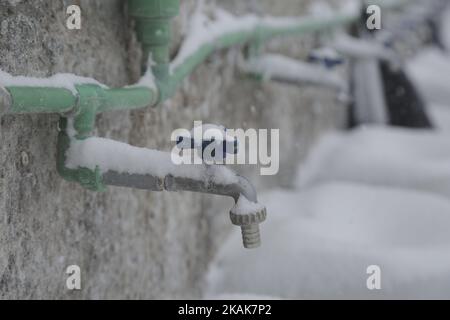 Water frozen in northern Greece in camps in or around Thessaloniki city on 11 January 2017. In Softex camp the temperature was -8Â°C with real feeling sense below -13Â°C and there was about 20cm of snowfall during a half day heaby snowstorm. The tents were snow covered. There is no running water as the pipes froze and many tents don't have electricity and heating. Also many refugees without document have been forced to leave the camp. (Photo by Nicolas Economou/NurPhoto) *** Please Use Credit from Credit Field *** Stock Photo