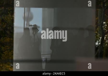 Berlin, Germany. 03rd Nov, 2022. The TV tower and journalists are reflected in a pane in the garden of the Federal Chancellery. Credit: Britta Pedersen/dpa/Alamy Live News Stock Photo