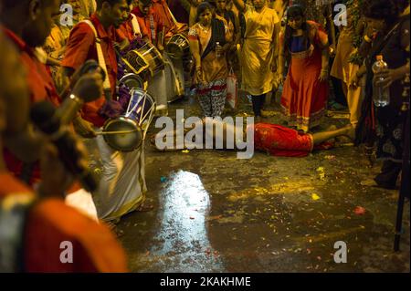 Hindus devotees possessed by the god reacts in a state of trance as he's heading to the Batu caves in Kuala Lumpur, Malaysia on February 04, 2017. To mark this day, Hindus devotees pierce different part of their body with various metal skewers and carry pots of milk on their heads along couple of kilometers to celebrate the honor of Lord Subramaniam (Lord Murugan) in the Batu Caves, one of the most popular shrine outside India and the focal point to celebrate the Thaipusam Festival in Malaysia. Thaipusam is an annual Hindu festival, observed on the day of the full moon during the Tamil month o Stock Photo
