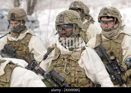 US Army's 503rd Infantry Regiment Specialist Estriado (in centre) participating in 3 days 53km joint march. Over 200 soldiers of the U.S. Army's 503rd Infantry Regiment and the C Company of the Estonian Defence Forces' Scouts Battalion are held a three-day, 53-kilometer trek from Voka to Narva in Ida-Viru County (North-Eastern Estonia) on February 6 - 9, 2017 (Photo by Sergei Stepanov/NurPhoto) *** Please Use Credit from Credit Field *** Stock Photo