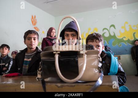 The children of Mosul go back to school as Isil is pushed out of Iraq's second city. Thirty schools have reopened in Mosul so far, welcoming back 16,000 students, according to Unicef. Forty more schools serving a further 24,000 children are expected to open in the coming weeks. Isil did keep some schools running during its two and a half year occupation of Mosul. But most parents shunned these institutions, where the terrorist group provided its own teachers and the curriculum had a strong jihadist bent. Visible mark of ISIL presence in schools was painted over school murals. (Photo by Maciej  Stock Photo