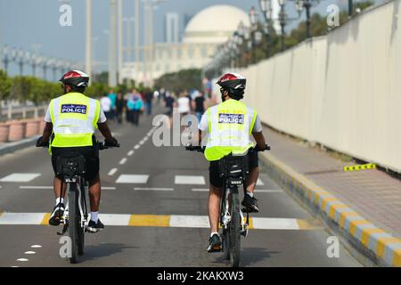 Two Abu Dhabi Police members patrol on their bikes Abu Dhabi Marina area. On Friday, February 24, 2017, in Abu Dhabi, UAE. (Photo by Artur Widak/NurPhoto) *** Please Use Credit from Credit Field ***  Stock Photo