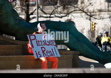 An unidentified man wears a Hillary Clinton mask in a sole protest at Logan Square, in Philadelphia, PA, on March 8th, 2017. (Photo by Bastiaan Slabbers/NurPhoto) *** Please Use Credit from Credit Field *** Stock Photo