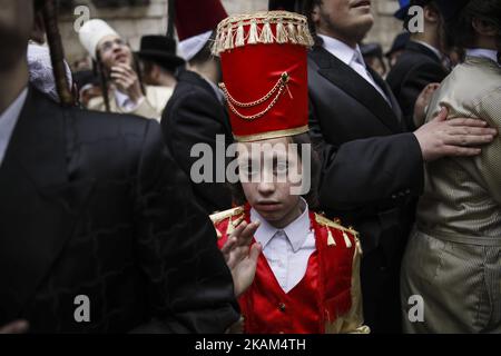 Ultra-Orthodox Jews wearing costumes celebrate the Jewish holiday of Purim in the ultra-Orthodox neighborhood of Mea Shearim in Jerusalem, Israel, March 13, 2017. The Jewish holiday of Purim celebrates the Jews' salvation from genocide in ancient Persia, as recounted in the Book of Esther. (Photo by Corinna Kern/NurPhoto) *** Please Use Credit from Credit Field *** Stock Photo