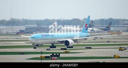 A Korean Air Boeing 777 plane taxiing down the runway at Chicago O'Hare International Airport (ORD) Stock Photo
