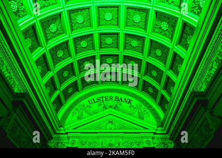 The Ulster Bank building on Dame Street in Dublin goes green on the eve of St Patrick's Day. On Thursday, March 16, 2017, in Dublin, Ireland. (Photo by Artur Widak/NurPhoto) *** Please Use Credit from Credit Field ***  Stock Photo