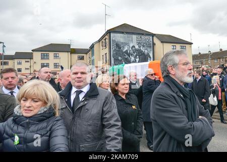 Sinn Fein President Gerry Adams walks in front of the coffin of former Northern Ireland Deputy First Minister Martin McGuinness in procession in the Bogside neighbourhood of Derry on its way to St. Columba's Church Longtower for Requiem Mass, On Thursday, March 23, 2017, in Londonderry, Northern Ireland. (Photo by Artur Widak/NurPhoto) *** Please Use Credit from Credit Field *** Stock Photo