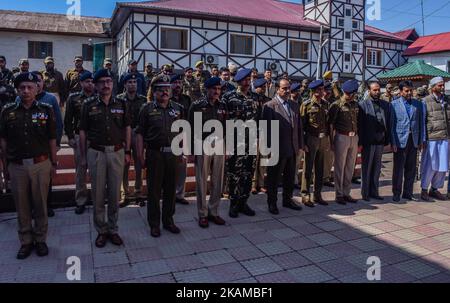 Senior Indian police officers and administrative officers stand to honour, near the coffin containing the body of policeman killed in a grenade attack by suspected militants, during a wreath laying ceremony on April 03, 2017 in Srinagar, the summer capital of Indian administered Kashmir, India. A wreath laying ceremony was held today for an Indian policeman who was killed and 14 others wounded when suspected militants lobbed a hand grenade yesterday evening on their patrolling party in the Nowhatta area of Srinagar. (Photo by Yawar Nazir/NurPhoto) (Photo by Yawar Nazir/NurPhoto) *** Please Use Stock Photo